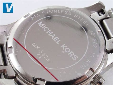 back of real and fake michael kors watch|michael kors watch serial number look.